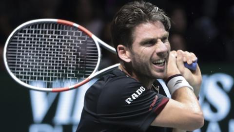 Cameron Norrie hits a backhand