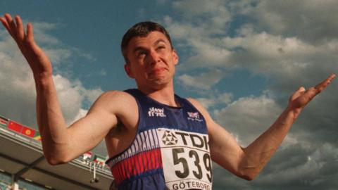 Jonathan Edwards celebrates after setting the triple jump world record in 1995