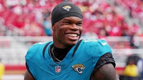 Travis Hunter smiles after the Jacksonville Jaguars' win at the San Francisco 49ers