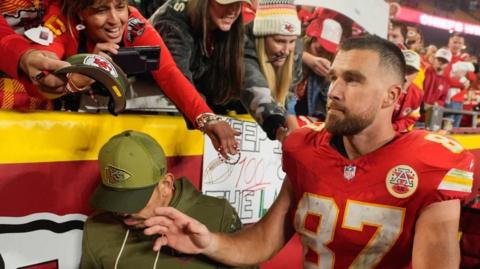 Travis Kelce meets fans after the Kansas City Chiefs' win over the Washington Commanders
