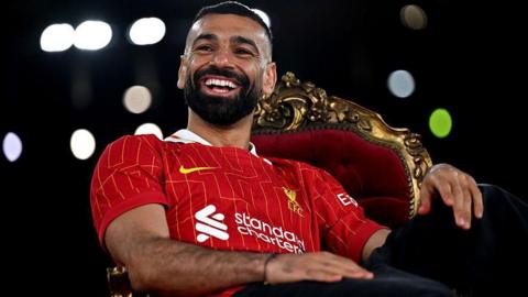 Mohamed Salah sits on a throne