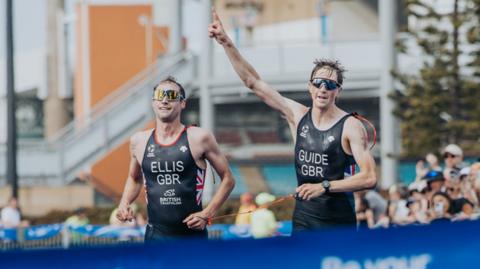 Dave Ellis and guide Luke Pollard cross the finish line in Australia