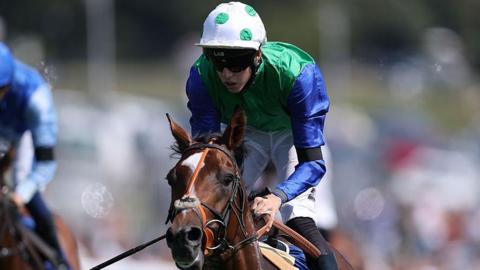 Tommie Jakes rides Gascony to win the Betfred Nifty 50 nursery race at Epsom in August