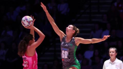 Jacqui Newton (right) of Cardiff Dragons reaches for the ball during the 2025 Netball Super Cup match between London Pulse and Cardiff Dragons at Utilita Area Sheffield