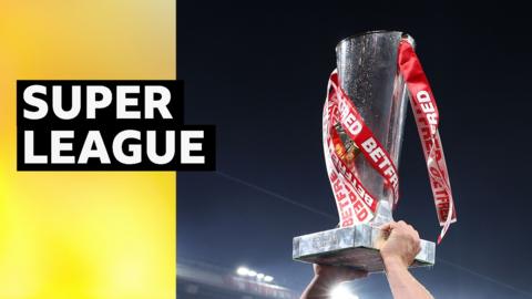 The Super League trophy is lifted aloft