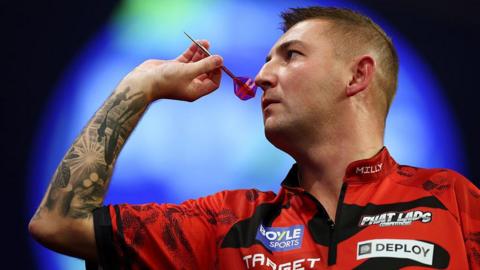 Nathan Aspinall throwing a dart