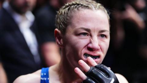 Molly McCann adjusts her mouthguard before a UFC fight