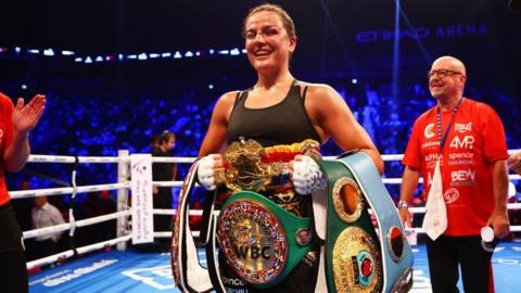 Chantelle Cameron with world title belts