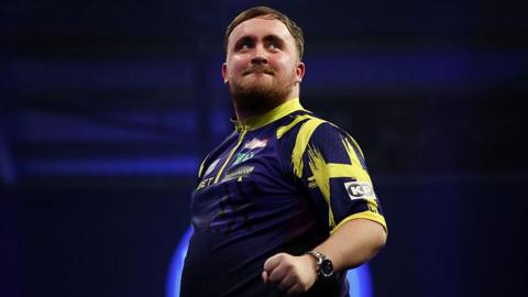 Luke Littler celebrates beating Mike de Decker at the World Grand Prix