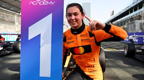Race winner Ella Lloyd of Great Britain and Rodin Motorsport (20) celebrates in parc ferme during F1 Academy Round 2, race 1 at Jeddah Corniche Circuit on April 19, 2025 in Jeddah, Saudi Arabia.