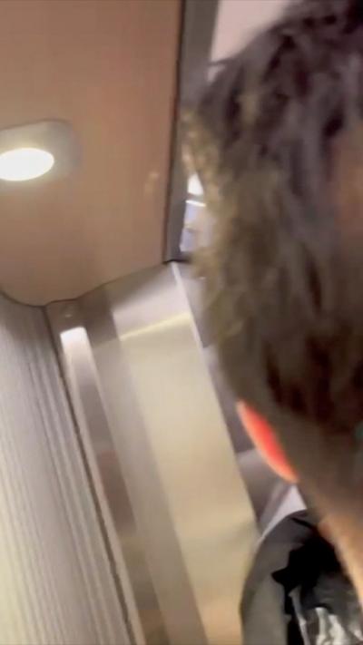 The back of a man's head in a train carriage