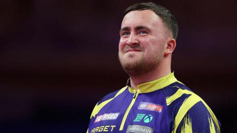 Luke Littler smiling