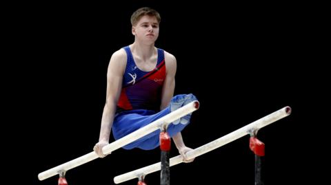 Alexander Yolshin-Cash of Notts Gymnastics Academy competes on the Parallel Bars in the Mens Artistic Senior All-Around during Day Three of the 2024 Gymnastics British Championships