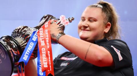 Beau Greaves with the Women's World Matchplay trophy in 2024
