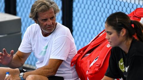 Francisco Roig chatting with Emma Raducanu