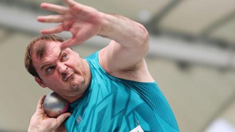 Vladimir Sviridov taking part in shot put