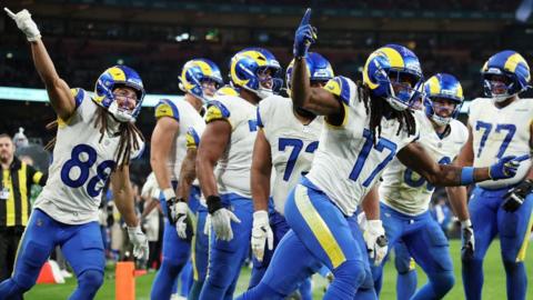 Davante Adams celebrates scoring a touchdown for the Los Angeles Rams against the Jacksonville Jaguars at Wembley